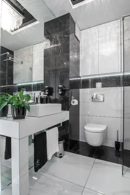 a bathroom with a sink and a toilet at Crystal Luxury Apartments Rakowicka 22H in Kraków