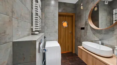 a bathroom with a sink and a mirror at Rakowicka Podkowa City Center, Sun & Snow in Kraków