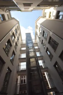 a view from the bottom of two tall buildings at Piłsudskiego In City Apartments in Kraków