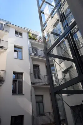 an external view of a building with a glass facade at Piłsudskiego In City Apartments in Kraków