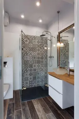 a bathroom with a shower and a sink at City of The Kings Piano Apartment in Kraków