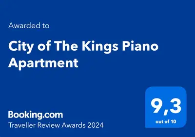 a blue sign with the city of the kings pianos planned appointment at City of The Kings Piano Apartment in Kraków