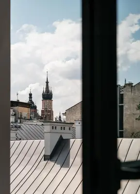 a view of a city from the roof of a building at District17 by StayLab in Kraków