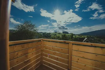 a wooden privacy fence with a view of the sky at u Jagody in Mszana Dolna