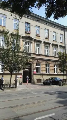 a person standing in front of a building at Leonardo in Kraków