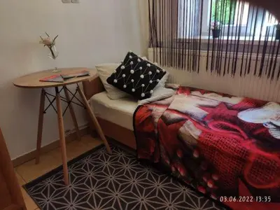 a room with a bed and a table and a table sidx sidx sidx at Your trip apartment (1) in Kraków