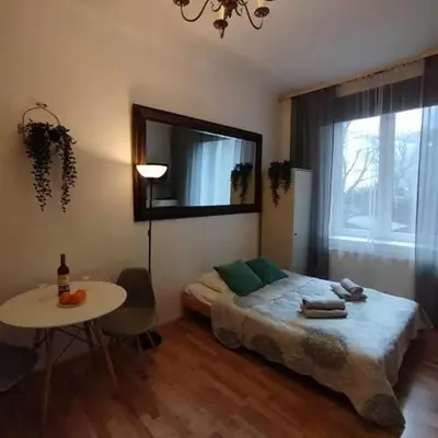 an empty hallway with two doors and a window at Your trip apartment (1) in Kraków