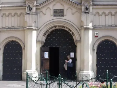 a woman standing in the doorway of a building at Your trip apartment (2) in Kraków