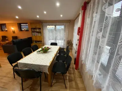 a dining room with a table and chairs at Dom do wynajęcia 