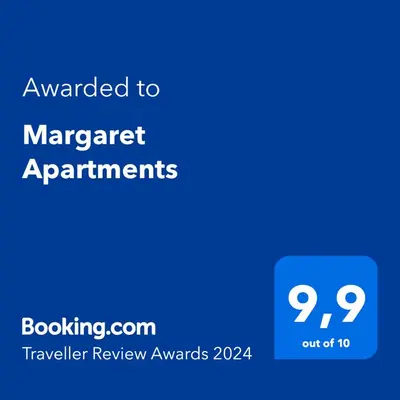 a screenshot of a phone with the text awarded to manager apartments at Margaret Apartments in Kraków