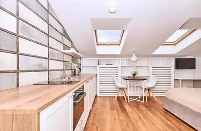 a kitchen with a sink and a table in a room at Chodkiewicza 10 (A) - cozy studio by Homeprime in Kraków