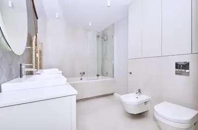 a white bathroom with a sink and a toilet at Chodkiewicza 10 (A) - cozy studio by Homeprime in Kraków