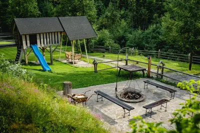 a playground with a picnic table at Góralska Willa in Nowy Targ