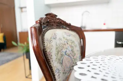a chair sitting at a table in a kitchen at Luxury in the Heart of the Old Town in Kraków