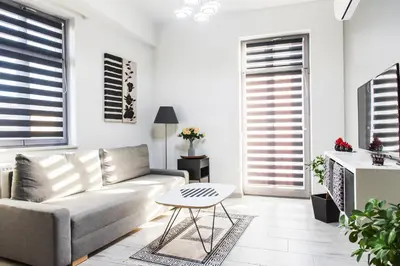 a living room with a couch and a table at Apartament Solny Centrum Wieliczka 11 in Wieliczka