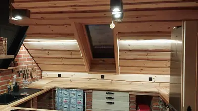 a kitchen in a log cabin with a sink and a tv at Mountain cabin in Pcim