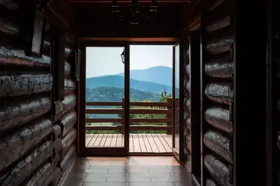 an open door with a view of a mountain at Mountain cabin in Pcim
