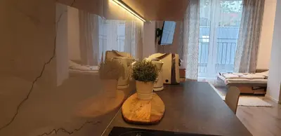 a living room with a table with vases on it at Modern Apartment close to the center by Krakow Home in Kraków