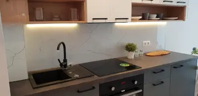 a kitchen with a sink and a stove top oven at Modern Apartment close to the center by Krakow Home in Kraków