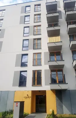 an exterior view of a building with balconies at Apartments Olit Bajeczna in Kraków