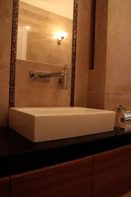 a white sink in a bathroom with a mirror at Villa Julia in Kraków