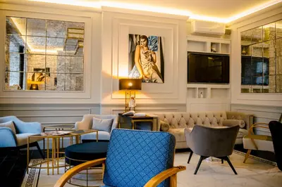 a hotel room with a bed and a table and chairs at Amber Design Residence in Kraków