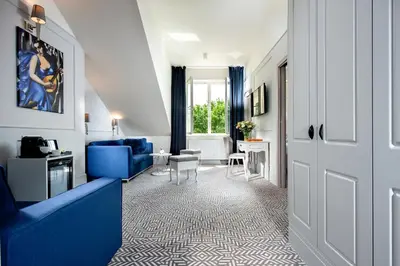 a bathroom with a walk in shower and a sink at Amber Design Residence in Kraków