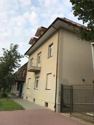 a building with a balcony on the side of it at Apartment Family Krakow in Kraków