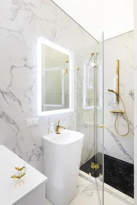 a white bathroom with a sink and a shower at Golden Fish - New Apartment - Old Town in Kraków