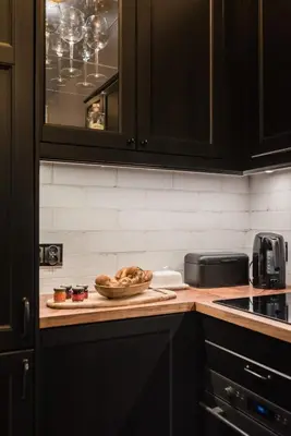a kitchen with a bowl of food on a counter at Wooden Horse - New Apartment - Old Town in Kraków