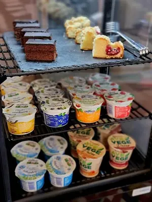 a display of different types of desserts and cakes at Rainbow Apartments 1 Premium in Kraków
