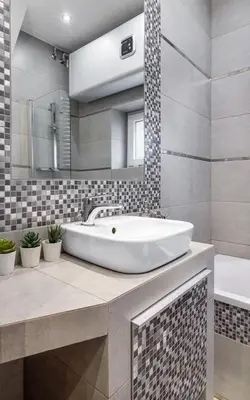 a bathroom with a tub and a sink and a mirror at Rainbow Apartments 1 Premium in Kraków