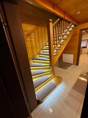 a large room with a bed and a couch in a cabin at Beskid House Kurów in Kurów