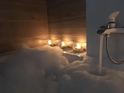 a bath room with a pretend cloud bathroom with lights at Old Town Premium Kazimierz Apartments in Kraków