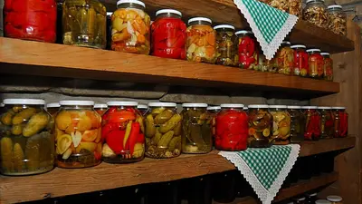 a shelf filled with jars of pickles and jams at Krakowiacy i Górale in Krzyszkowice