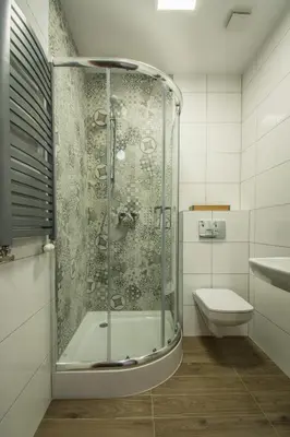 a bathroom with a shower and a toilet at Hotel Lavender in Kraków