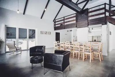 a dining room with a table and chairs at Pradnik Valley Lodge in Prądnik Korzkiewski