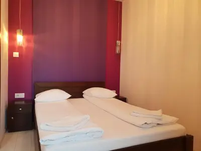 a bedroom with two beds with towels on them at Pawia Apartments Modern in Kraków