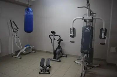 a gym with exercise bikes and a punching bag at Dom Studencki Atol in Kraków