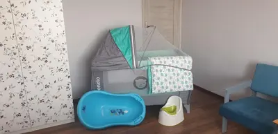 a toy room with a bed and a chair at Guzikowa Chata in Dobczyce