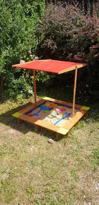 a picnic table sitting on top of a wooden platform at Guzikowa Chata in Dobczyce