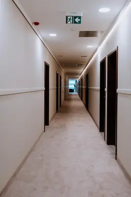 an empty corridor of an office building with a hallway at Mark1 in Brzesko