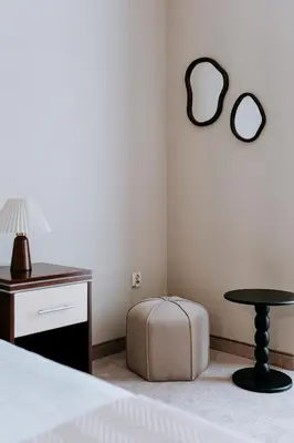 a bedroom with a bed and a table and a stool at Mark1 in Brzesko