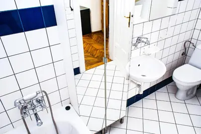 a bathroom with a toilet and a sink at Large and cozy Apartment 60 m2, Cracow Old Town in Kraków