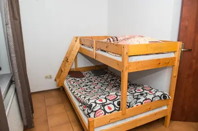 a couple of bunk beds in a room at Parkowa House in Kraków