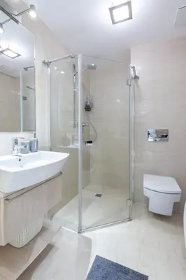 a bathroom with a shower and a sink and a toilet at Kopernika8 Miro Apartment with Balcony and AC in Kraków