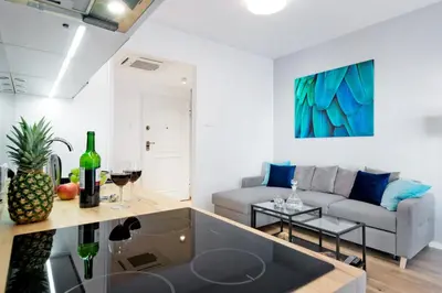 a living room with a couch and a table at Kopernika8 Miro Apartment with Balcony and AC in Kraków