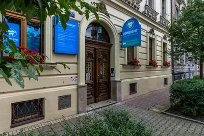 a building with a large wooden door on a street at Beautiful Cracow Apartments by Cozyplace in Kraków