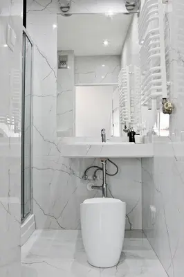 a white bathroom with a sink and a toilet at Elegant City Center Apartment Pawlikowskiego 8 in Kraków