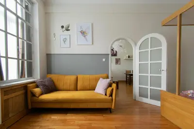 a living room with a couch and a table at Stylish 2 bedroom apartment Morsztynowska street in Kraków